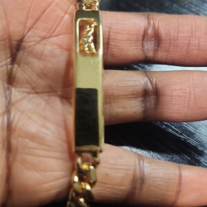 Longchamp Elegant Gold Toned Bracelet. Unisex